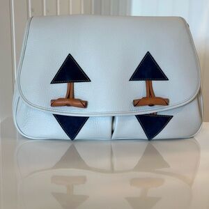 Dooney & Bourke Toggle white leather messenger bag.  Pebble Grain Collection.